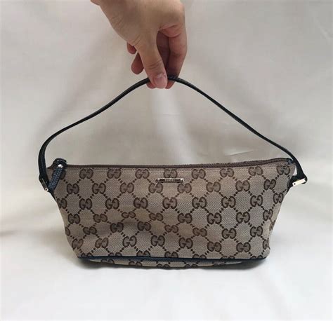 gucci boat pochette original price|Gucci leather shoulder bag.